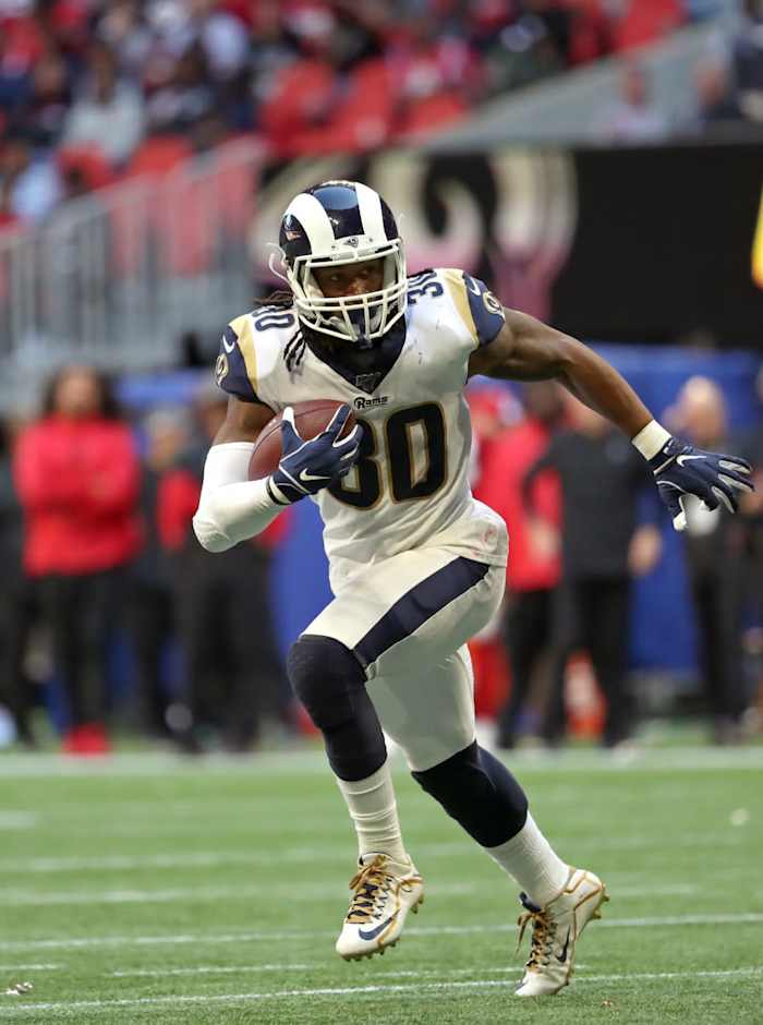 Rams running back Todd Gurley runs the ball in the fourth quarter against the Falcons at Mercedes-Benz Stadium in 2019.